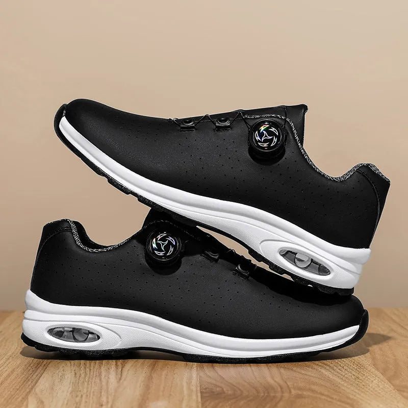Low-top black and white mesh casual shoes with cross shoulder strap and round toe on a composite sole.