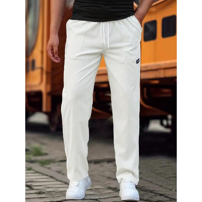 Men's light grey polyester casual trousers laid flat showing front design.