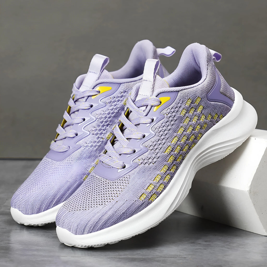 Women's lavender purple Flyknit running shoes with mesh lining and striped pattern on a white background.