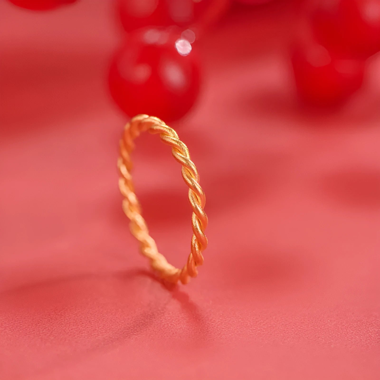 Brass gold plated women's ring showing twist, matte and glossy simple bracelet styles