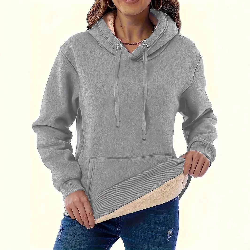 Women's black loose fit hooded sweater with pockets and long sleeves laid flat.