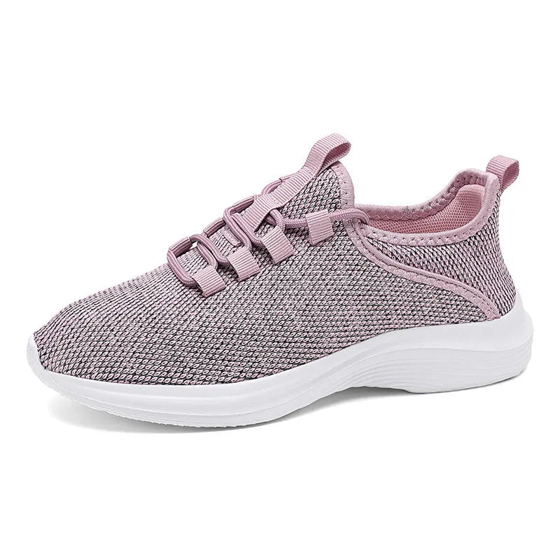 Women's low-top casual sneakers with Flyknit mesh upper in black, pink, or grey with round toe and lace-up front