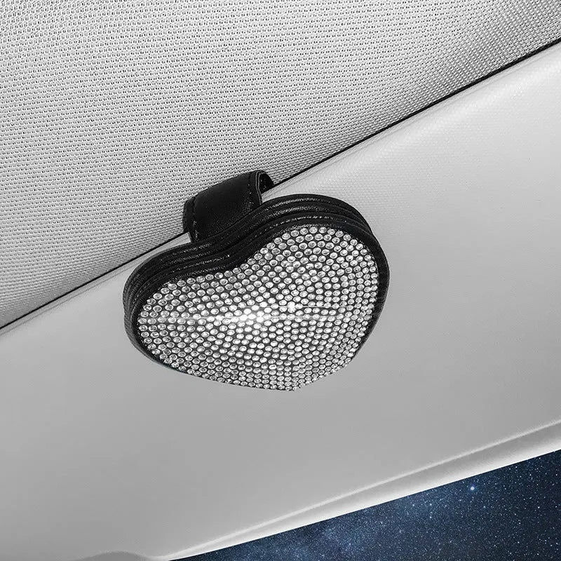 Black diamond-encrusted PU leather car sun visor clip holding sunglasses and a ticket.