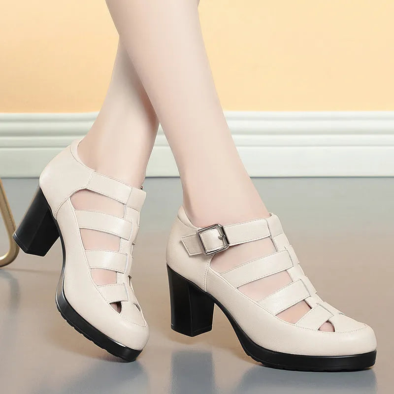 Women's beige closed toe sandals with a chunky heel, woven upper, and ankle strap buckle.