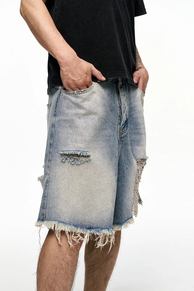 Light blue baggy denim shorts with wide leg cut and zipper fly
