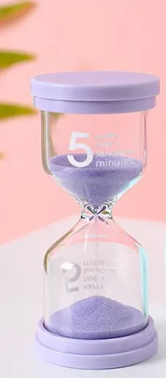 Handmade glass sand timer showing coloured sand flow with modern design, available in blue, green, pink or purple