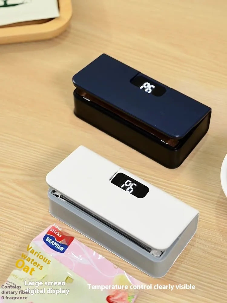 White portable mini heat sealing machine for plastic food bags measuring 4x3.5x14.4cm