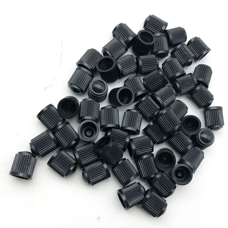 Black plastic tubeless valve with American mouth thread for GM models on white background