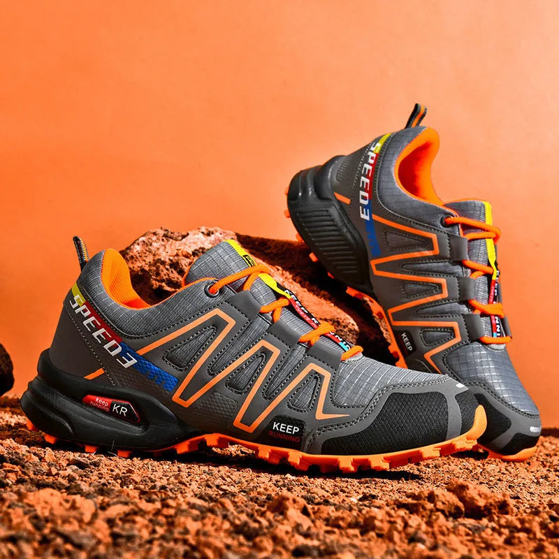 Men's grey orange plus size casual running shoes with synthetic leather upper and rubber sole.