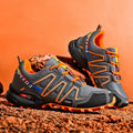 Men's grey orange plus size casual running shoes with synthetic leather upper and rubber sole.