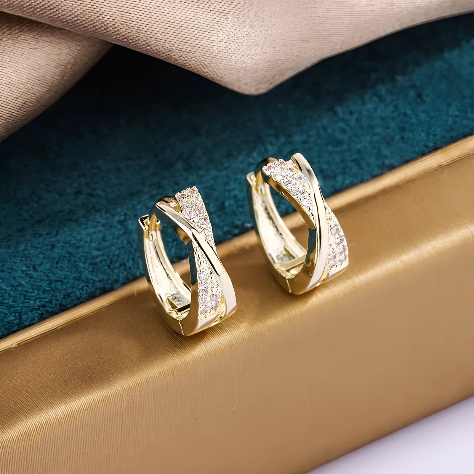 Geometric shape copper earrings with zircon accents in 14K yellow gold tone.