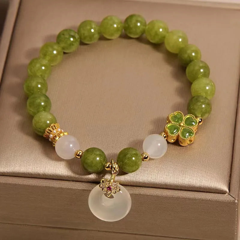 Green tourmaline four leaf clover women's bracelet with safety buckle, peace buckle, and lucky bag charm in New Chinese style.
