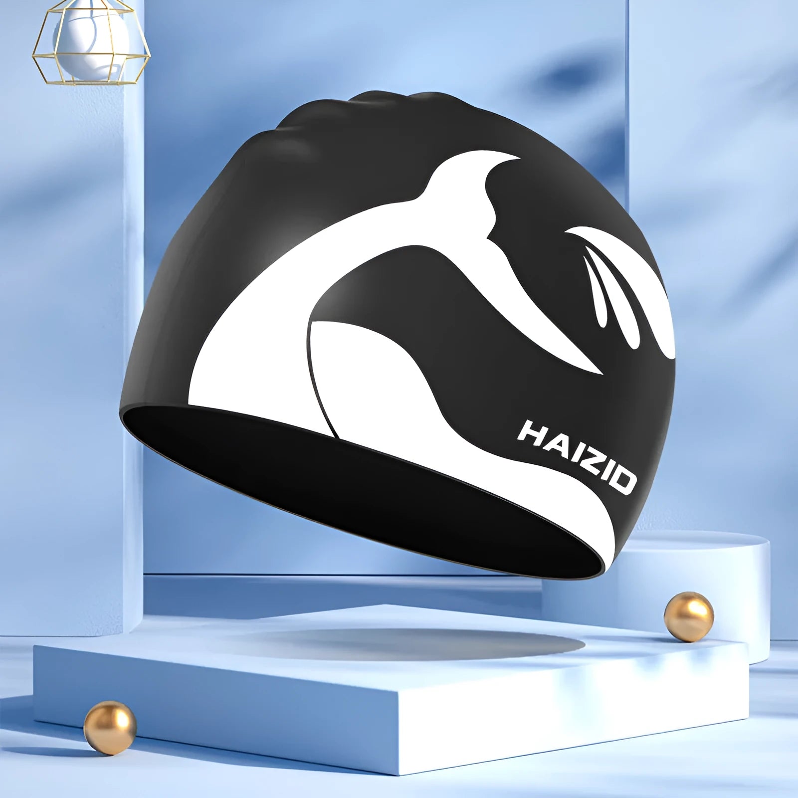 Silicone swim cap with ear protectors in whale tail design, shown in multiple colours.