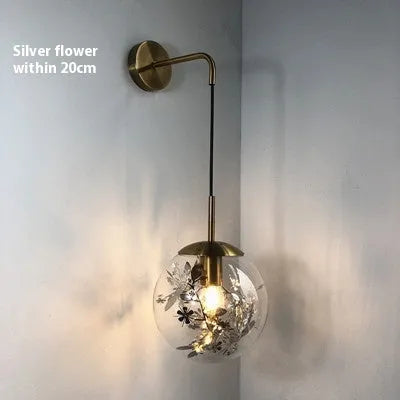 Modern glass bedside wall lamp in golden flower or silver flower finish