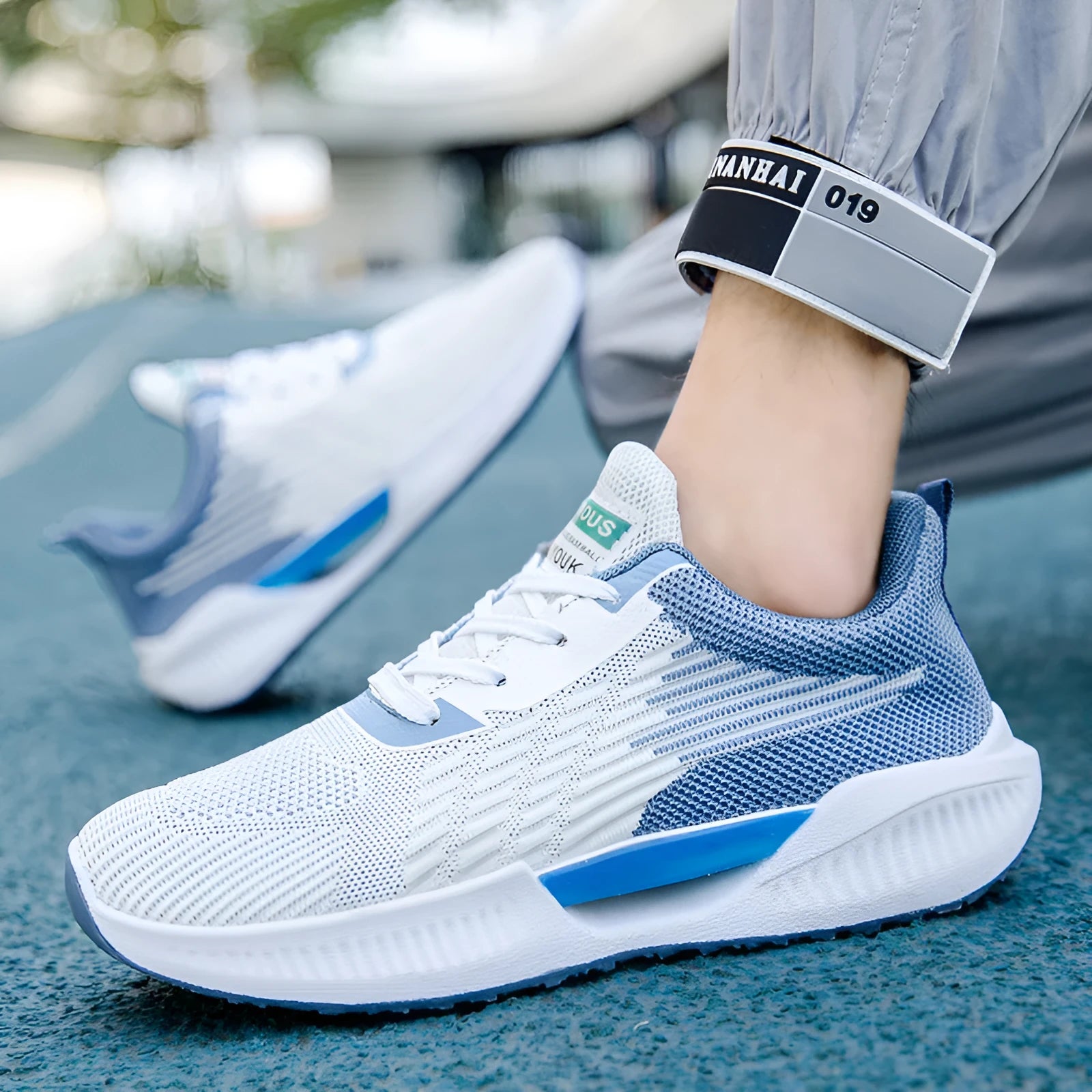 Men's blue casual mesh sports shoes with cloth upper and round toe on a plain background