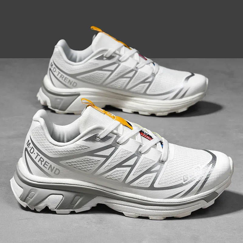 Low top hiking shoes in khaki with round toe, artificial leather upper, and flat rubber sole.