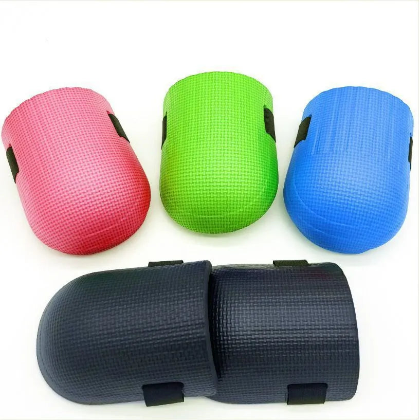 A pair of thick EVA foam knee pads in a choice of colours, for use on hard floors during auto repair or construction.