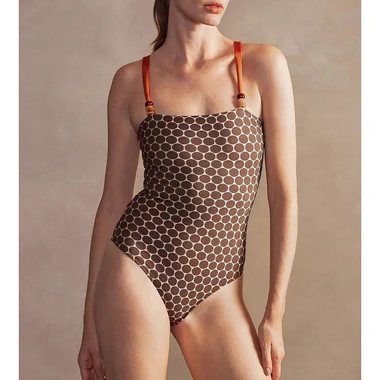 Women's printed dot pattern one-piece swimsuit with matching wrap skirt