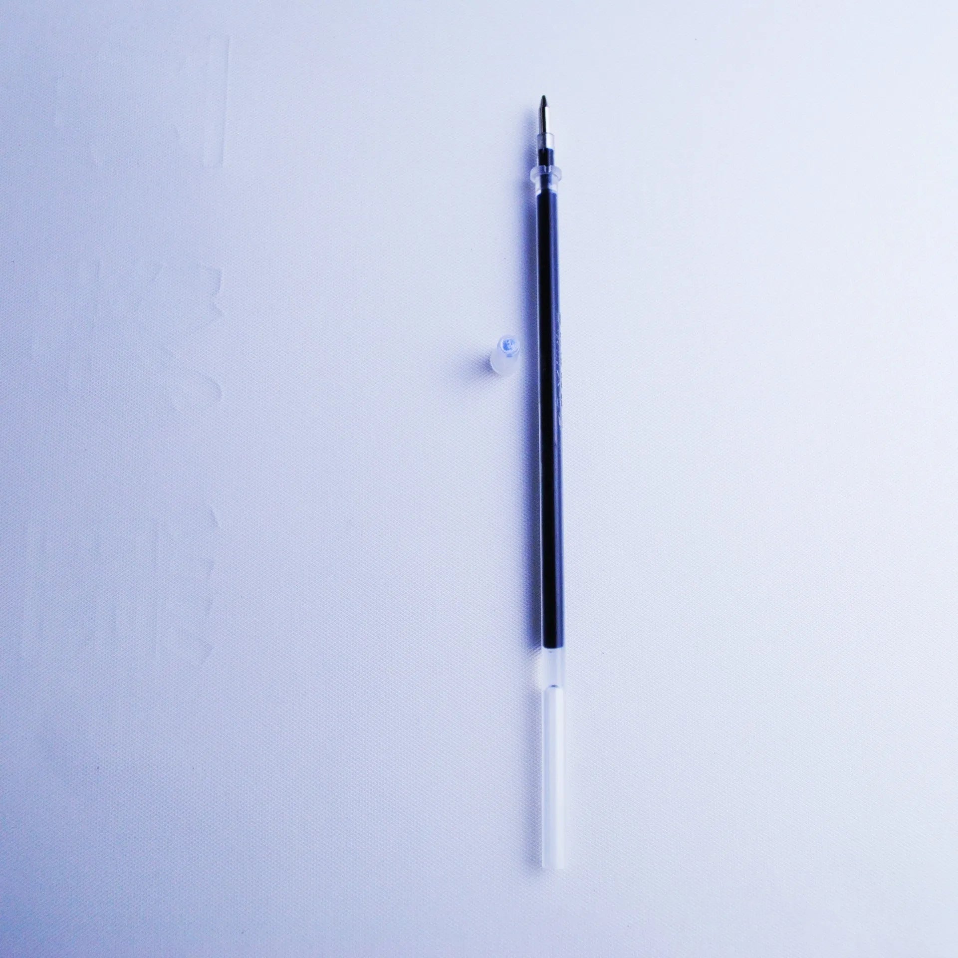 Blue household portable automatic fading pen set with 0.5mm tip, showing pen and eight spare refill cores.