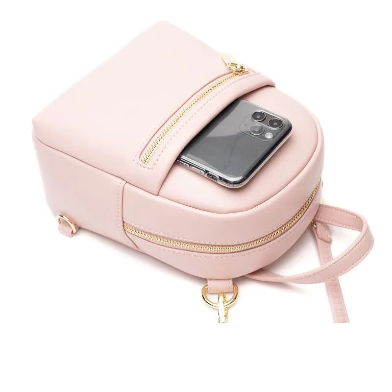 Soft PU mini backpack in street style with a three-dimensional front pocket, shown in multiple colour options.