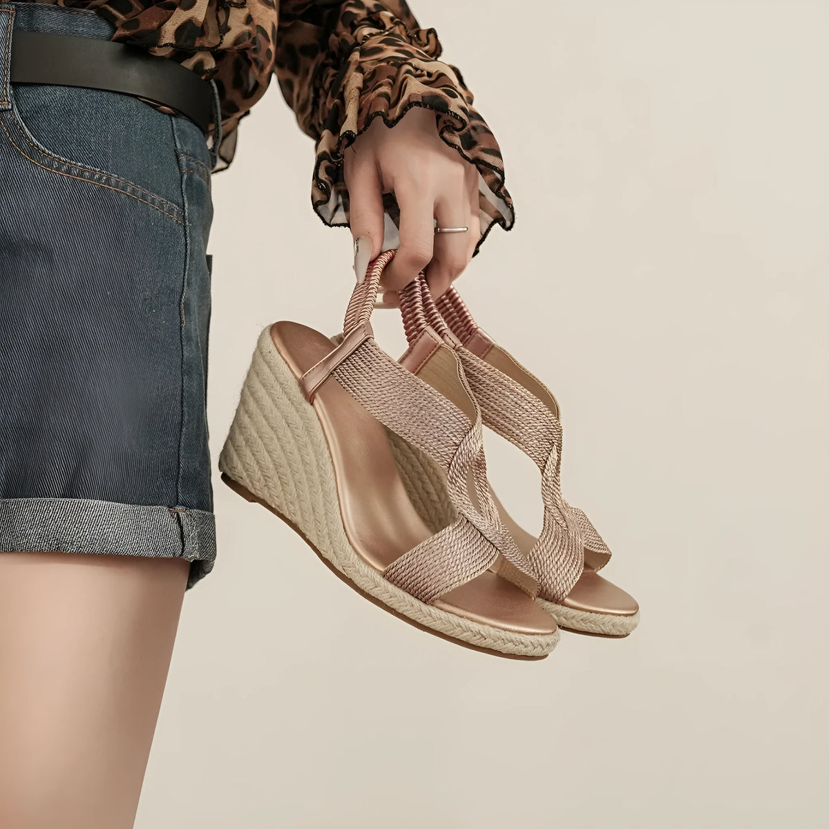 Rose gold women's platform wedge sandals with electric embroidery upper and round toe on a light background