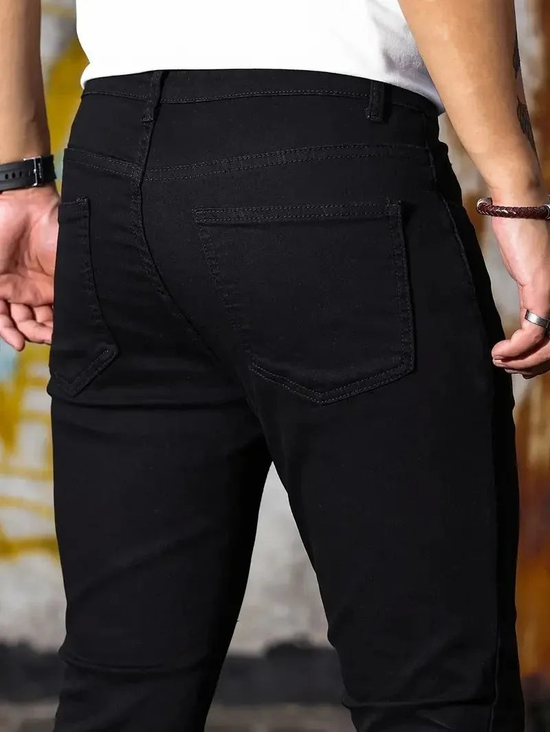 Men's retro washing stretch slim fit jeans in blue, front view, five-quarter length