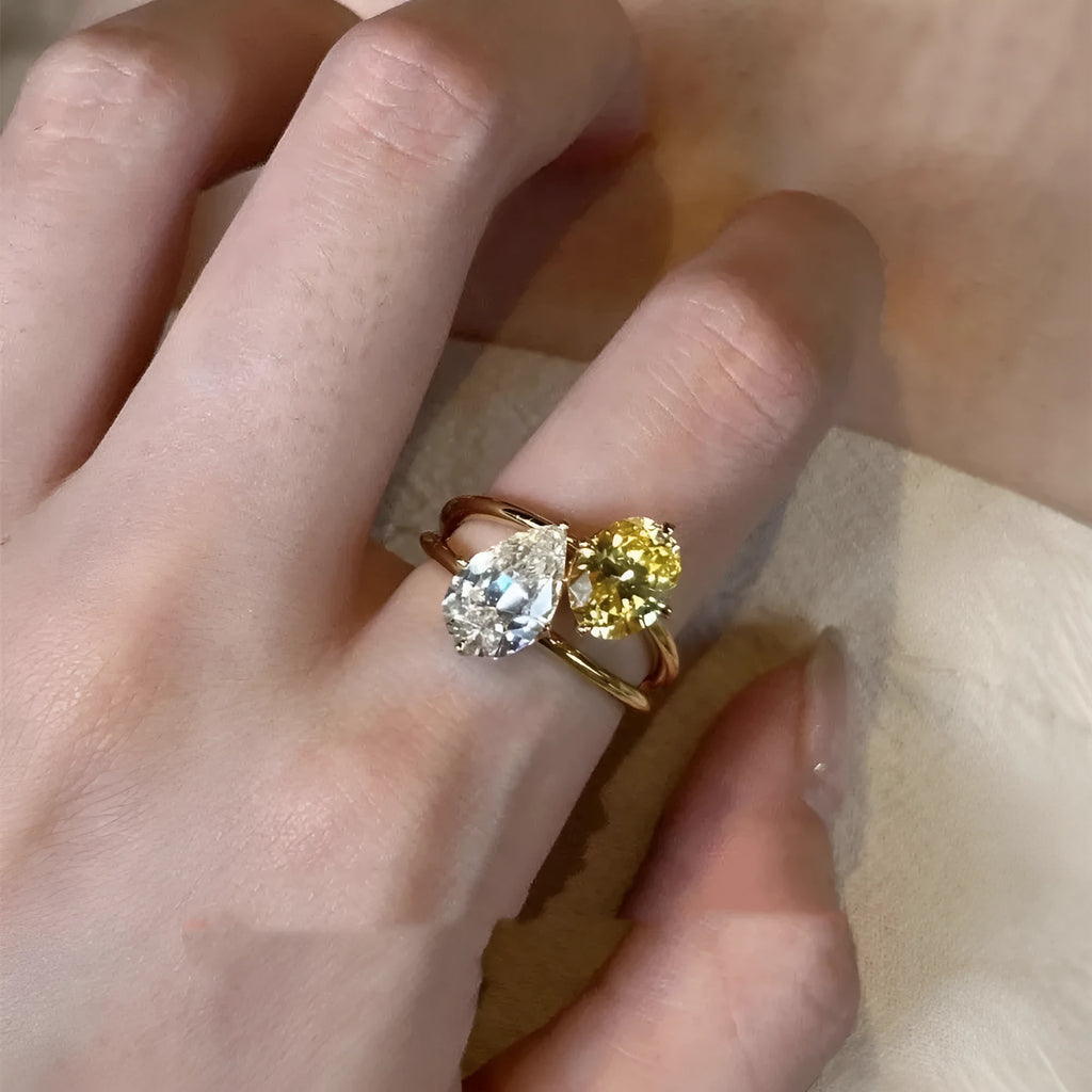 Copper geometric open ring for women featuring a water drop design with contrasting double sheng stones.