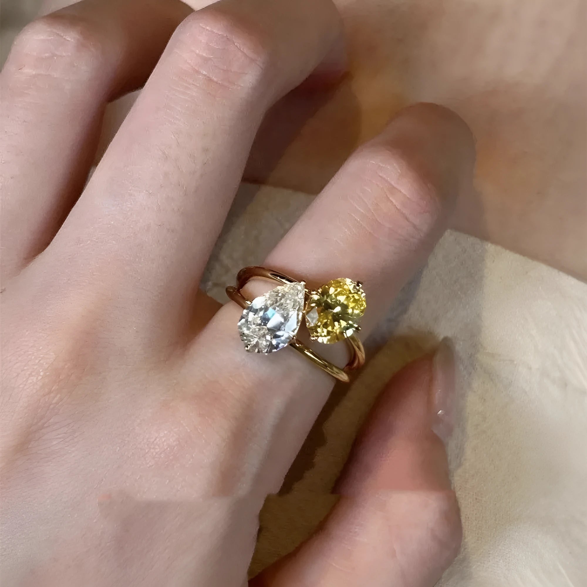 Copper geometric open ring for women featuring a water drop design with contrasting double sheng stones.
