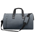 Medium oval travel holdall with multiple internal compartments open to show organisation.