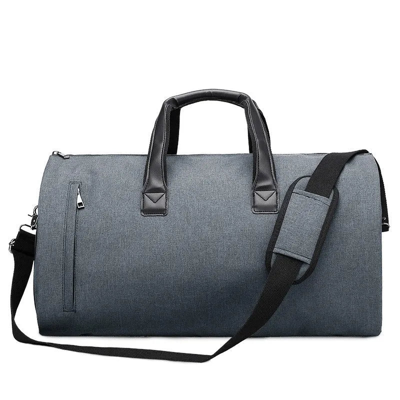 Medium oval travel holdall with multiple internal compartments open to show organisation.