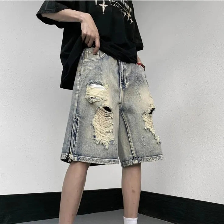 Blue retro denim shorts with a tattered finish and loose wide-leg cut on a mannequin