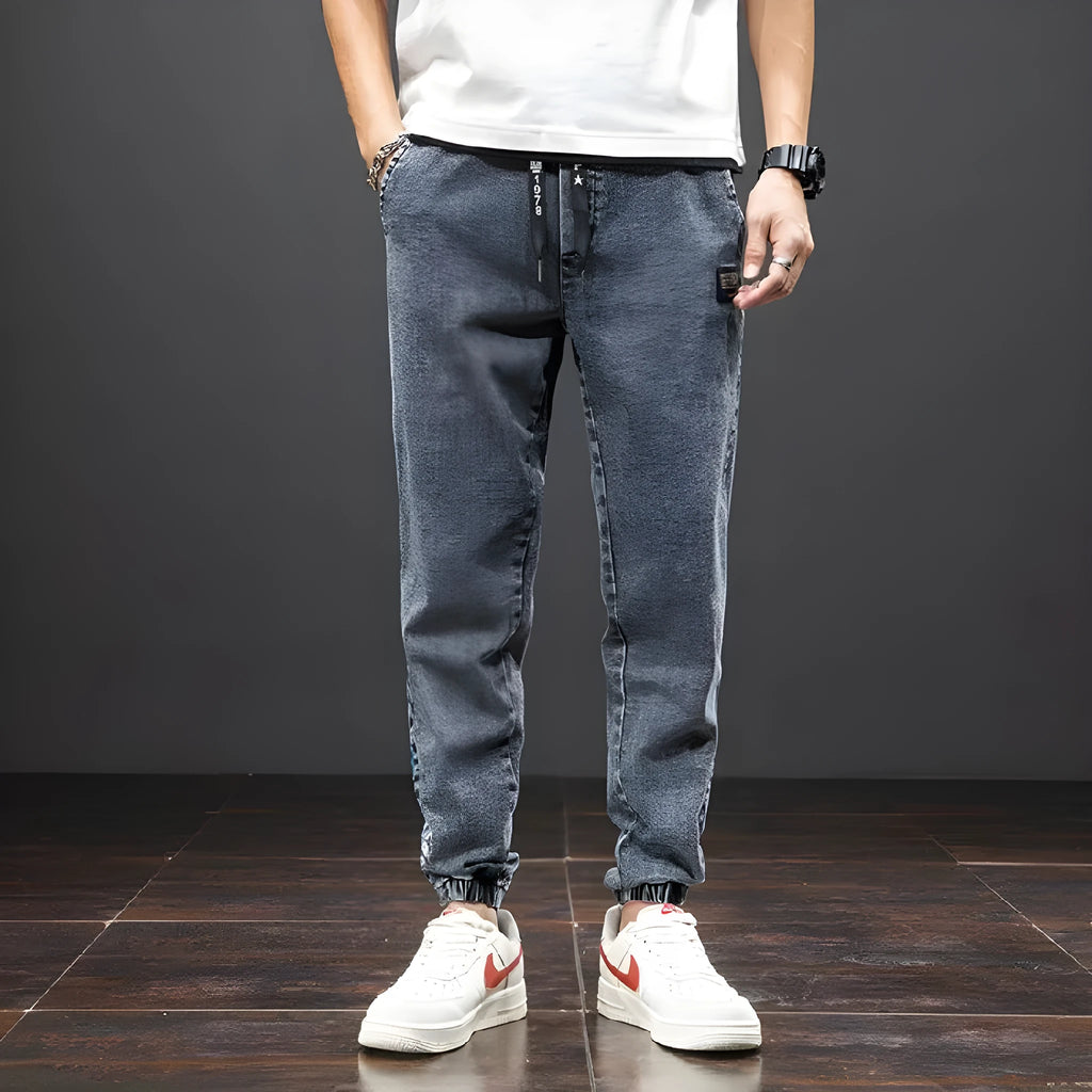 Men's casual loose stretch cotton jeans in black, available in sizes M to 8XL for relaxed daily wear