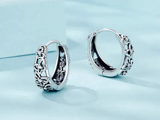 Sterling silver retro butterfly earrings with hollow design and zircon detailing