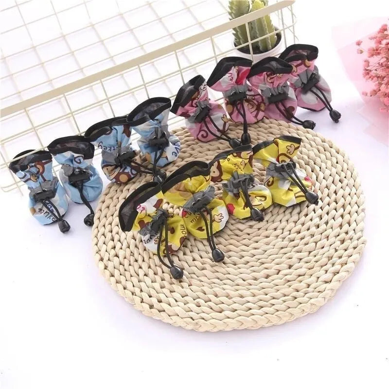 Set of four cloth dog shoes with soft soles in various colour options including fleece-lined variants