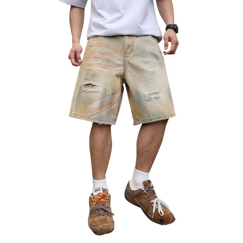 Men's light blue ripped denim shorts showing straight-leg design and mid waist fit