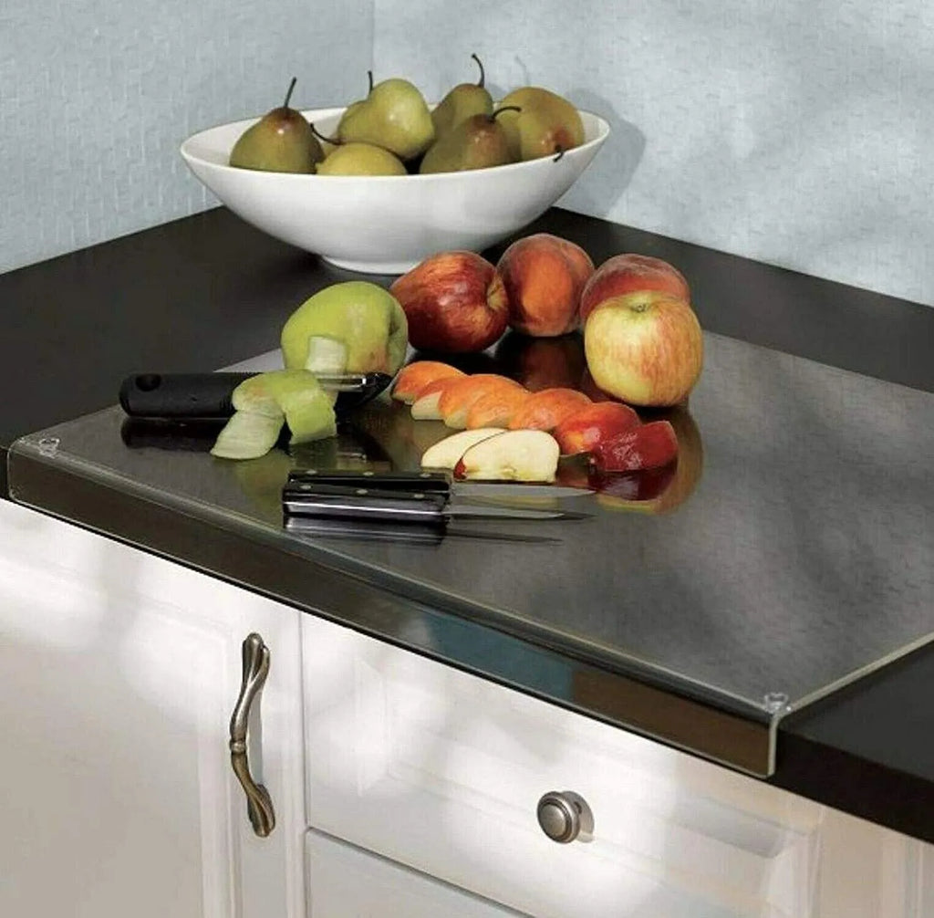 Transparent acrylic cutting board with anti-slip base on a kitchen counter