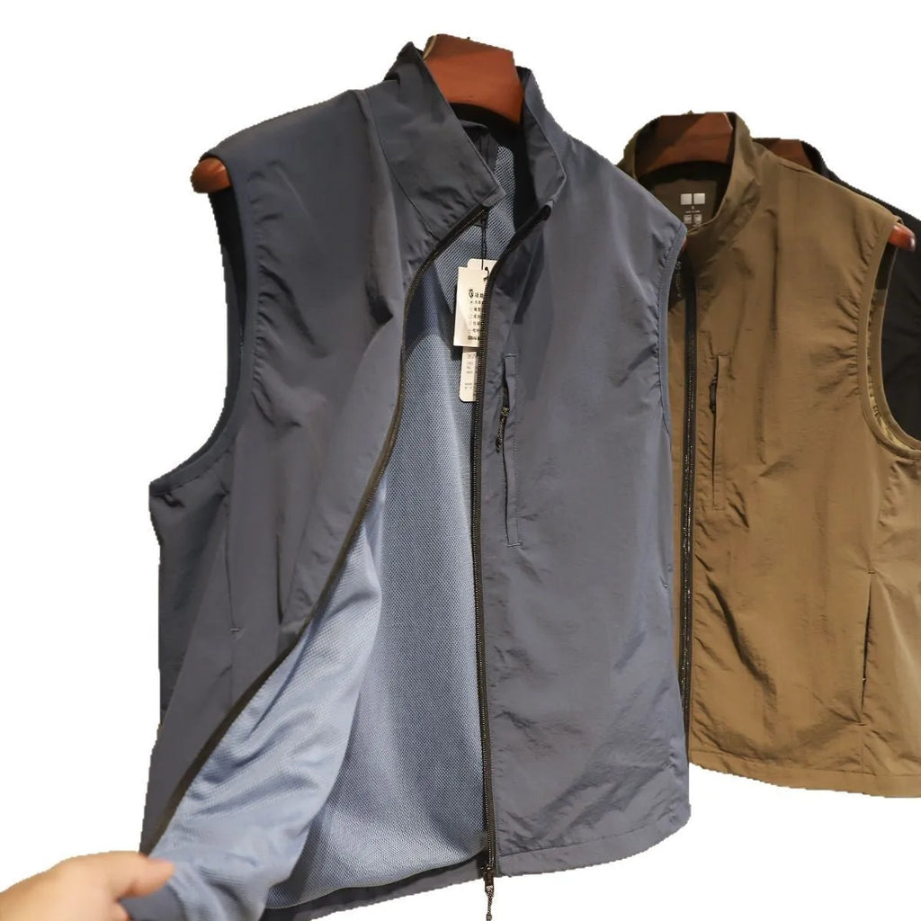 Men's straight-cut nylon vest in army green with side seam pockets, laid flat.