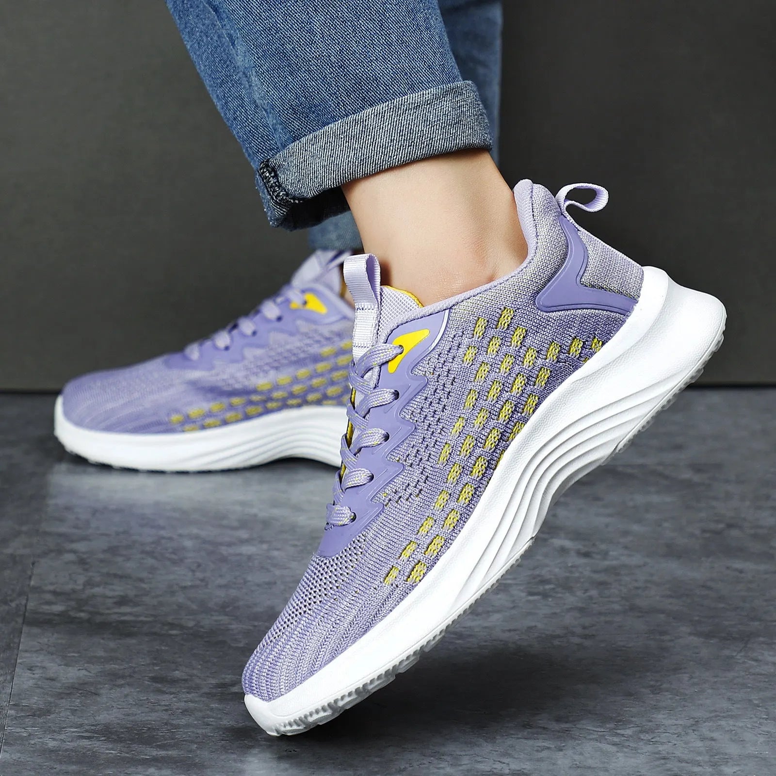 Women's lavender purple Flyknit running shoes with mesh lining and striped pattern on a white background.
