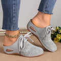 Women's baotou lace-up slippers with hollow-out wedge design in suede and rubber construction