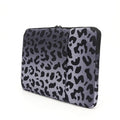 Leopard print flannel lined laptop sleeve for 13-inch to 16-inch devices with waterproof polyester exterior.