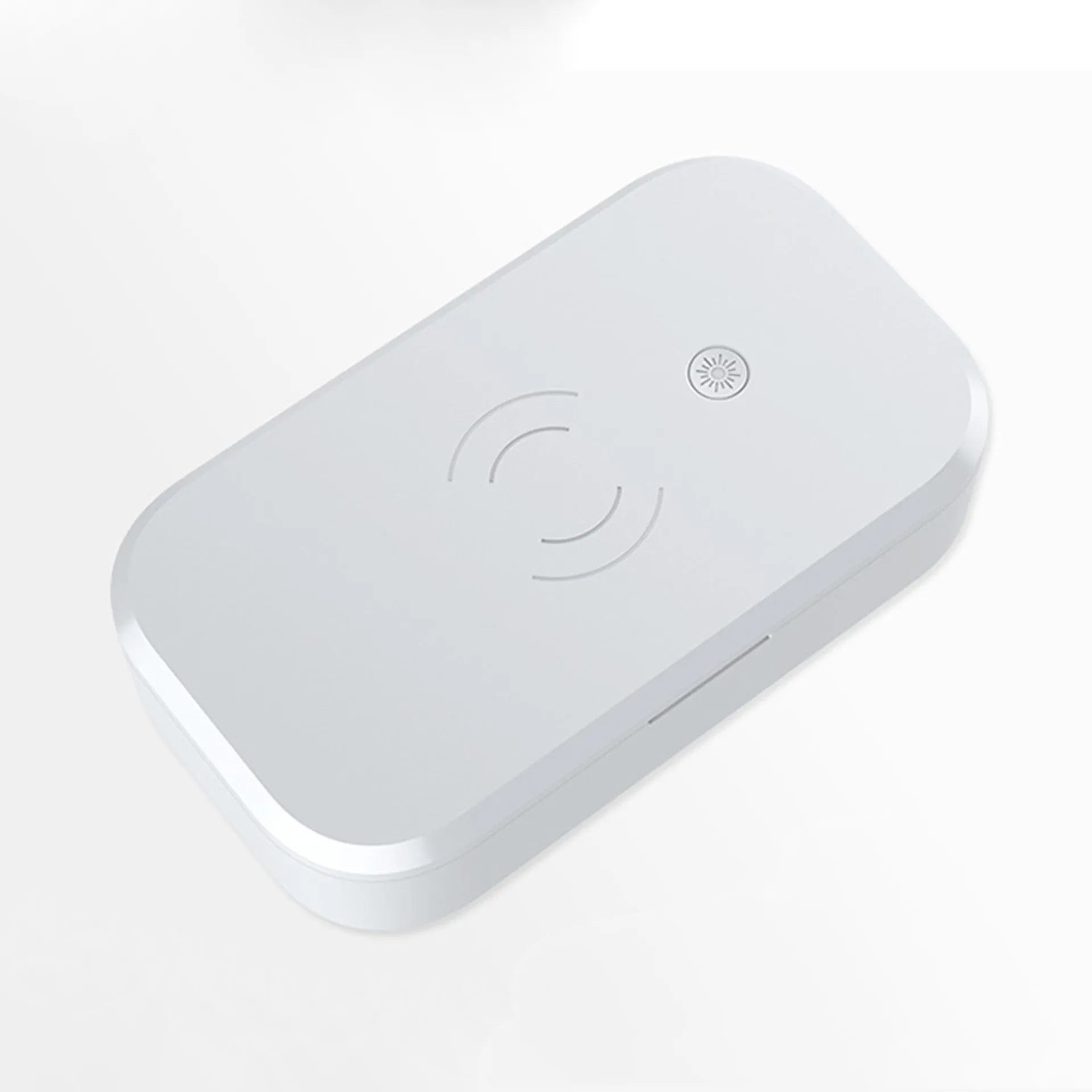 White ultraviolet disinfection box with wireless charging pad for mobile phones and nail tools