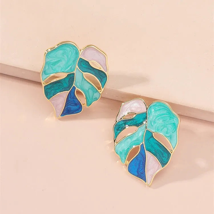 Maple leaf stud earrings with handmade drop oil finish, electroplated alloy, available in green or pink.