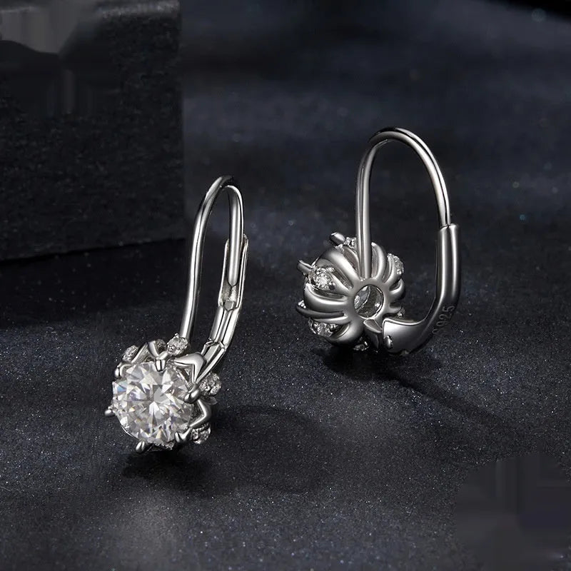 Sterling silver flower bud clip earrings with moissanite centre stone and white gold plating