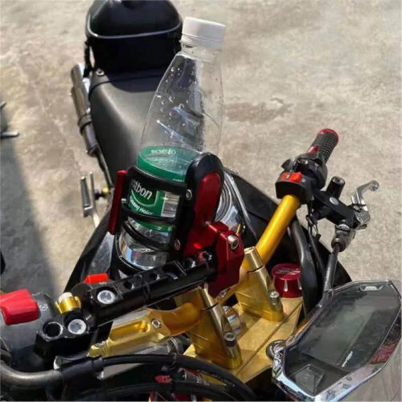 Black water bottle cage mounted on Honda X-ADV scooter modification