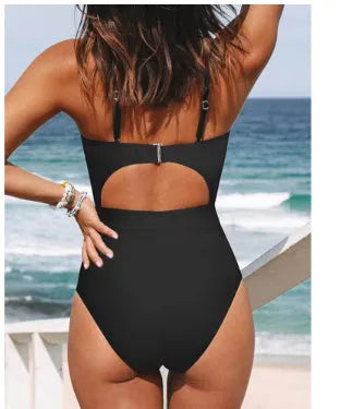 Women's solid colour backless one-piece swimsuit in polyester spandex blend on a mannequin.