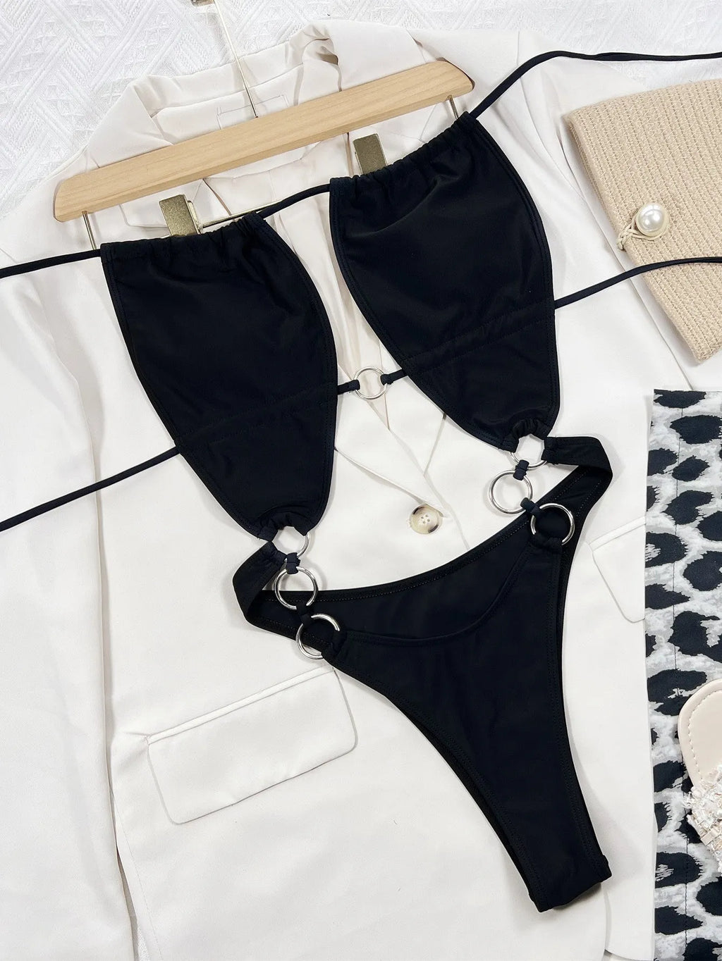 Black women's one-piece swimsuit with steel ring detail on sleeveless nylon design