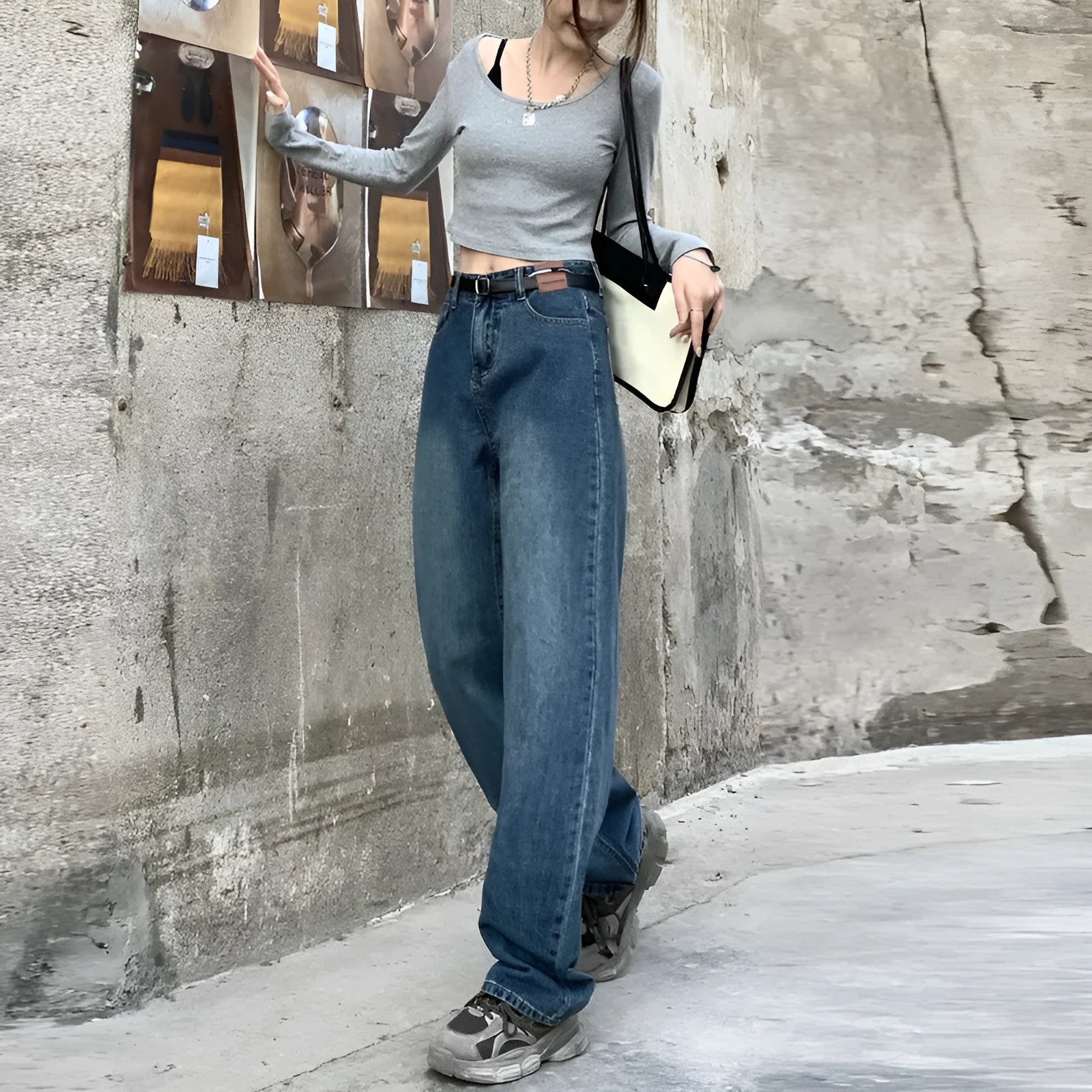 Women's retro blue straight leg jeans with a high waist, shown on a hanger.