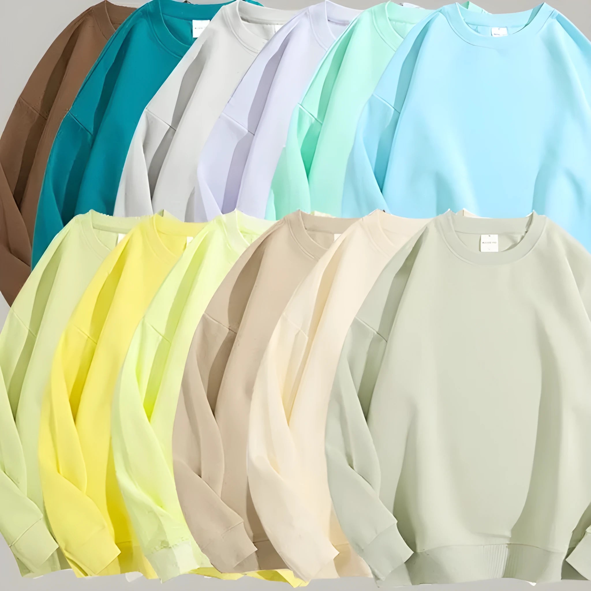 A woman wearing a loose-fit, off shoulder, long sleeve cotton pullover sweater in a solid colour.