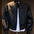 Men's black PU leather jacket with litchi texture and extended length in slim business fit