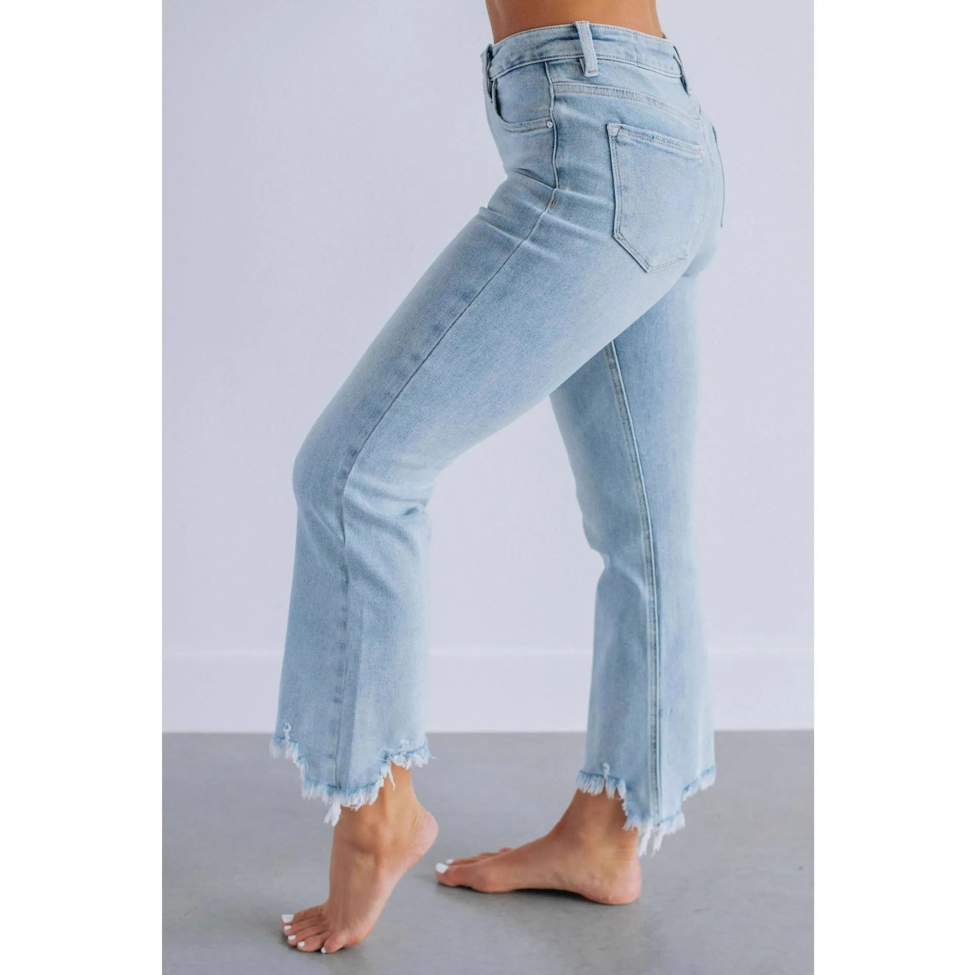 Women's solid colour cotton denim jeans with a hand-worn finish in dark blue.